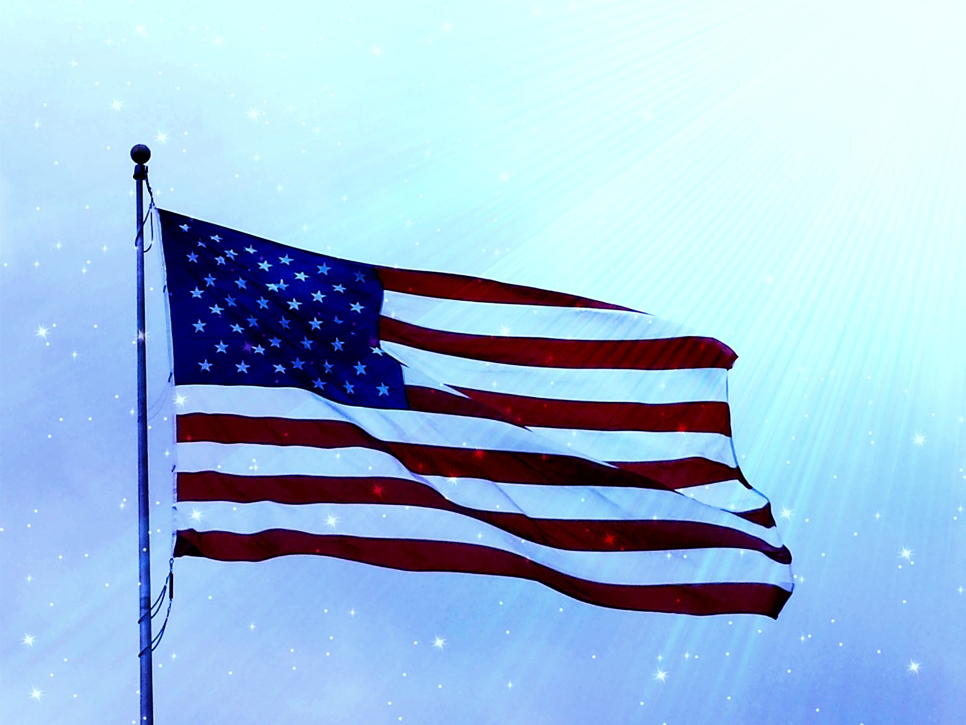 American flag flying against a blue sky